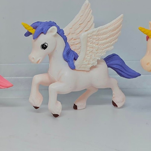 Set of 4 unicorn and pegasus figures like new