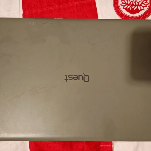 Quest Slimbook Plus 14.1" FHD laptop used with mouse and bag