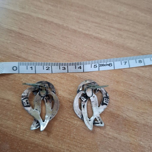 Vintage metal earrings used with abstract artistic design silver