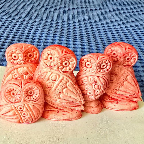 Set of five salmon pink owl figurines