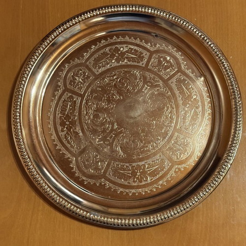 Vintage metal tray with embossed traditional designs used