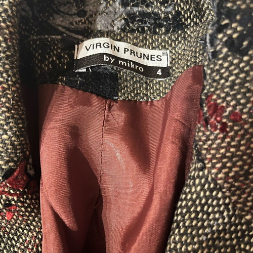 Brown jacket with burgundy patterns and details
