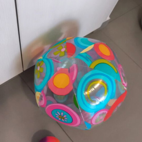 Inflatable beach ball and small plastic ball