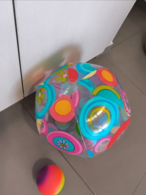 Inflatable beach ball and small plastic ball