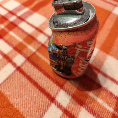Coca Cola lighter used