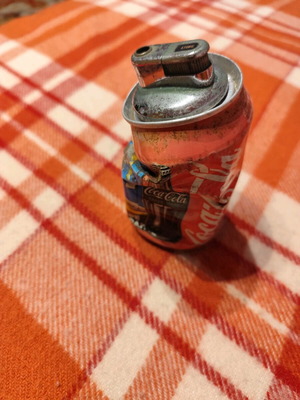 Coca Cola lighter used