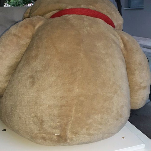 XXL teddy bear used with red bow and hearts