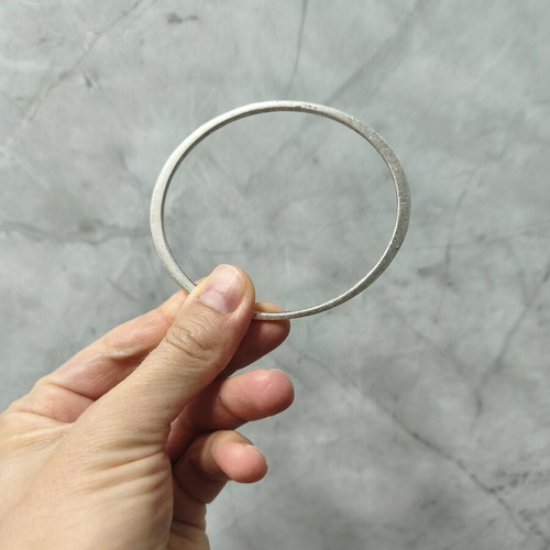 Brass bangle bracelet with matte silver finish