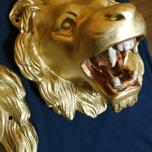 Decorative items used, cast iron lion heads, old antiques