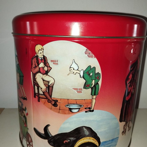Metal tin with Pinocchio images like new