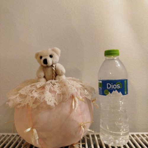Stuffed bear on ball like new