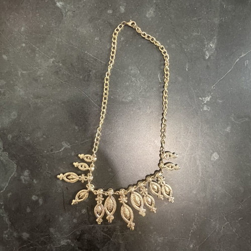 Women's gold necklace with black stones, used