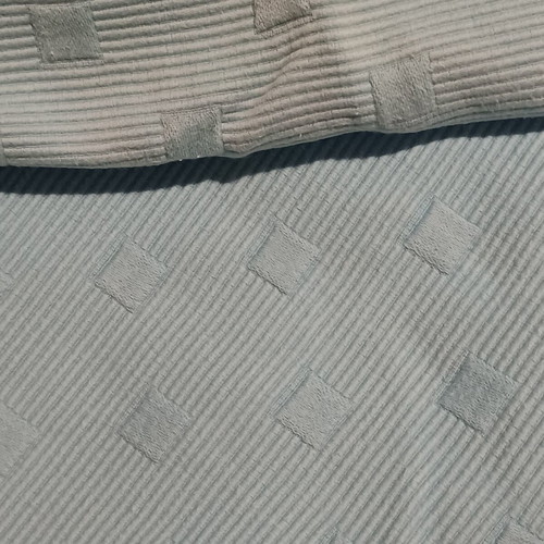 Quilted blanket and square pillowcase used