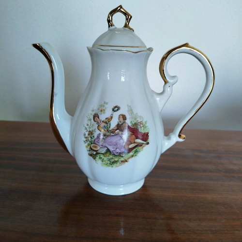 Porcelain teapot vintage with gold details used