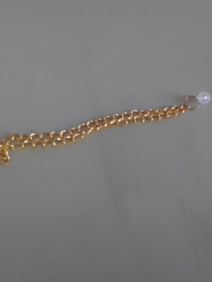Bracelet new gold plated with hanging white bead