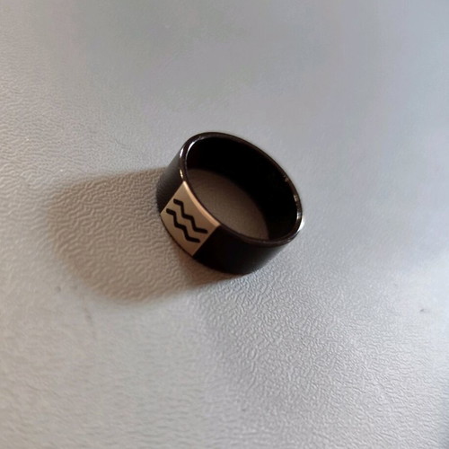 Aquarius ring like new, black, 1.8 cm wide