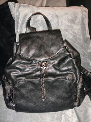 Backpack used, black with multiple pockets