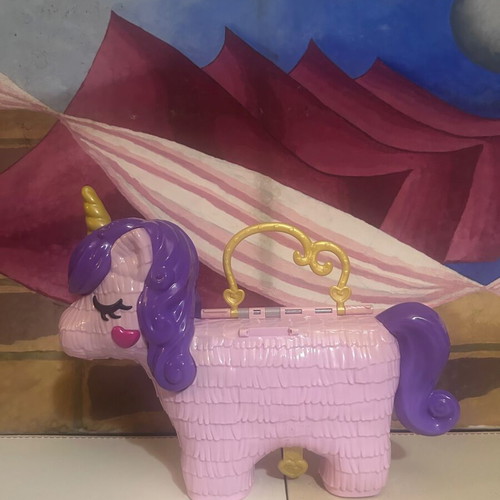 Polly Pocket Unicorn Party Playset used by Mattel
