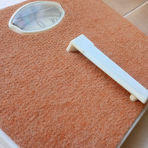 Vintage mechanical scale with carpet used