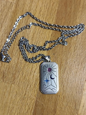 Necklace like new with sun and moon design