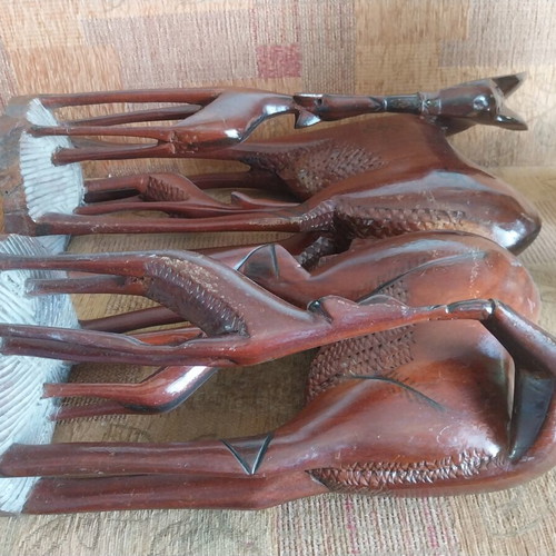 African woodcarvings used, two large gazelle sculptures, mahogany