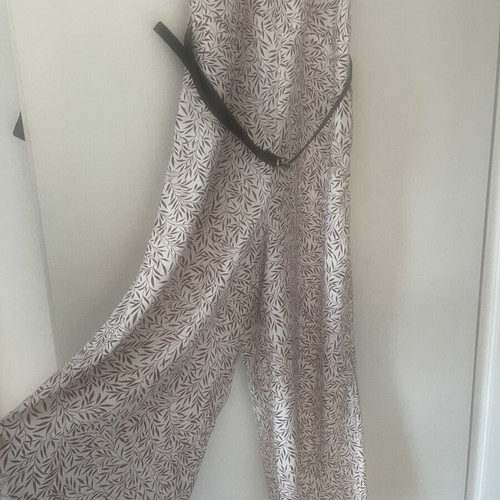 Regalinas sleeveless jumpsuit used, white with leaf print, sizes S/M