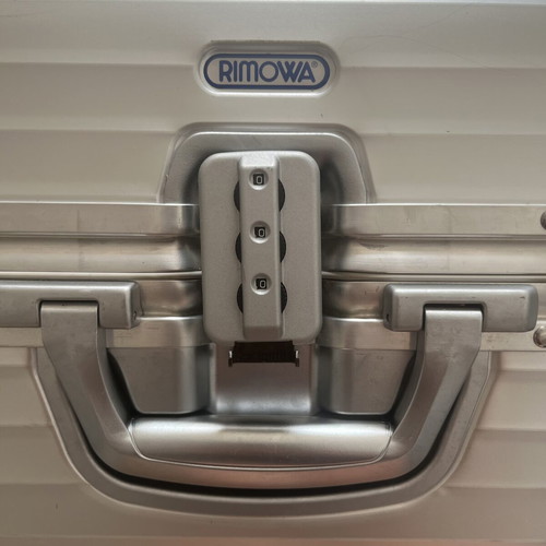 Rimowa travel bag used, silver color, slight defect
