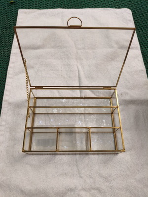 Glass jewelry box with gold metal frame, vintage style
