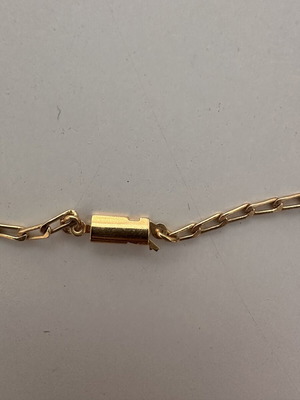 Vintage necklace with embossed white and gold decorations
