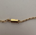 Vintage necklace with embossed white and gold decorations