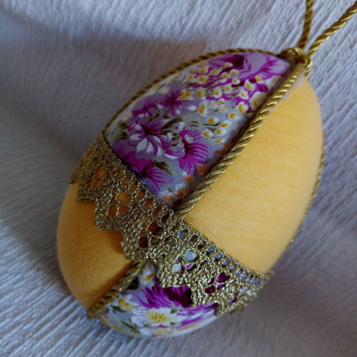 Decorative yellow floral egg used for Easter and spring decor