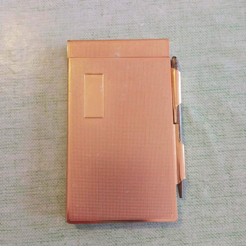 Vintage metal pocket notebook with integrated pencil used 1940-1950