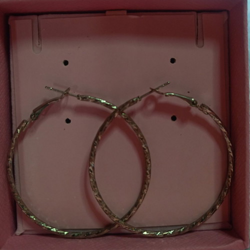 Hoop earrings with embossed design silver like new