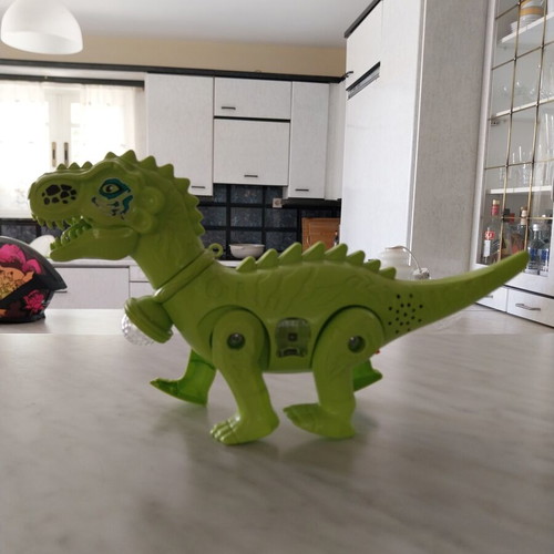 Dinosaur toy like new, walks, lights, and makes sounds, 28cm