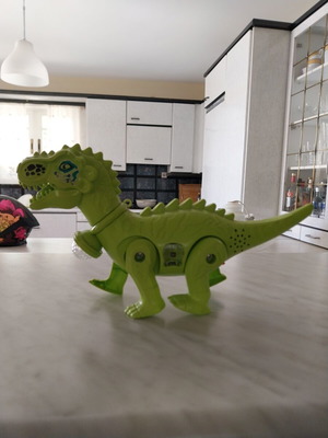 Dinosaur toy like new, walks, lights, and makes sounds, 28cm