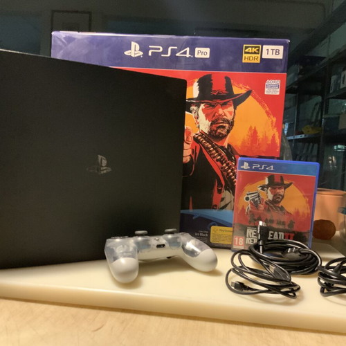 PlayStation PRO 1TB console with XRay controller, cables and Red Dead Redemption 2 game