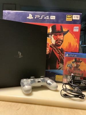 PlayStation PRO 1TB console with XRay controller, cables and Red Dead Redemption 2 game