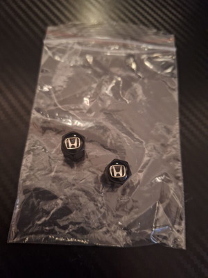 Honda black valve caps like new, set of 2