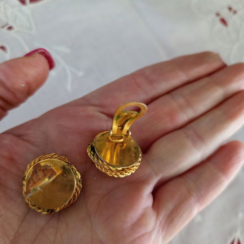 Vintage clip-on earrings used with gold embossed design and white pearl