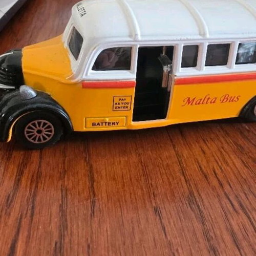 Collectible toy cars used, London Taxi and Valletta bus