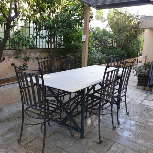 Marble table with 6 metal chairs