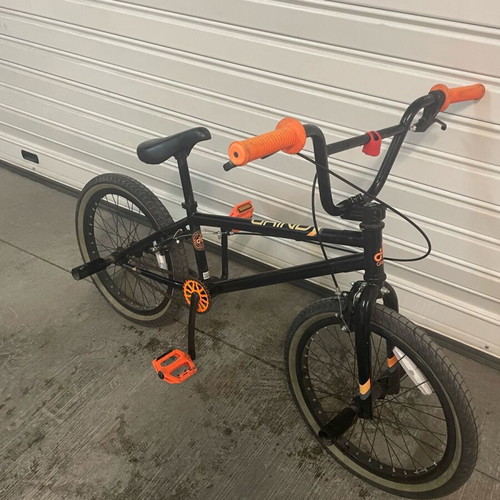 BMX bicycle like new, black, with extra metal pegs for tricks