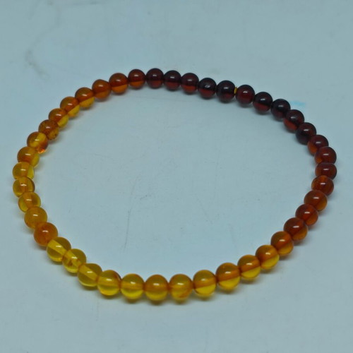 Handmade bracelet from natural amber with color gradient like new