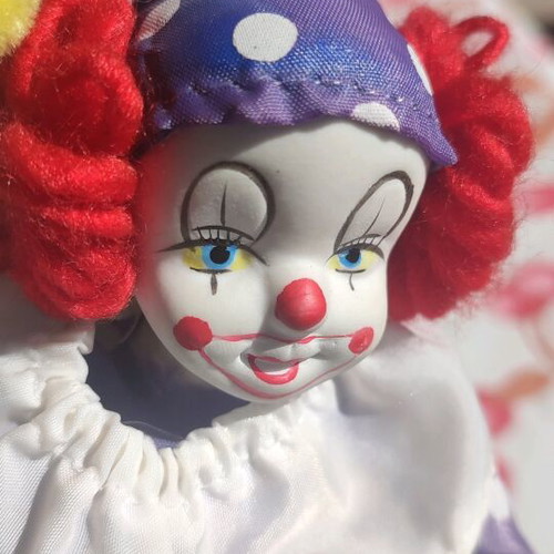 Vintage porcelain clown doll used