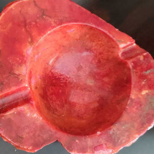 Large ashtray used red with veins