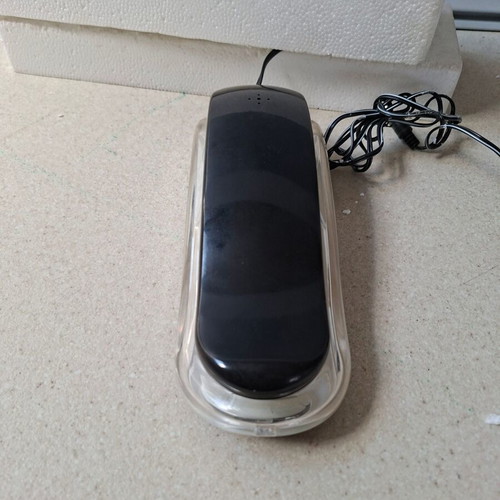 Vintage wired home phone with transparent neon design, new