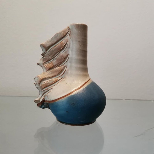 Handmade clay vase used with wavy finish