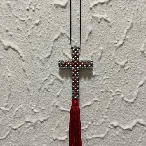 Decorative cross with beads and red tassel like new