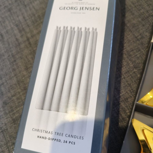 Georg Jensen gold-plated star candle holders with candles