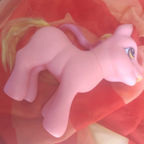 Large pink pony toy with colorful mane and tail